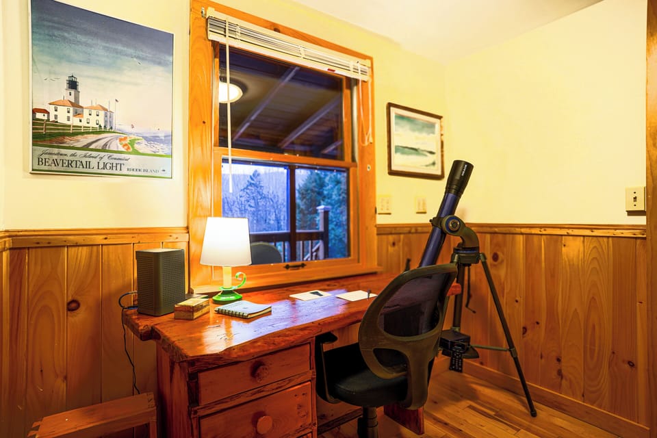 Work-friendly desk & telescope. (This room connects the log and timber sides.)