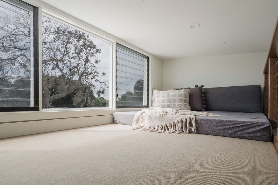 The cozy loft is a peaceful escape. NOTE ladder is STEEP and fitted with a guard