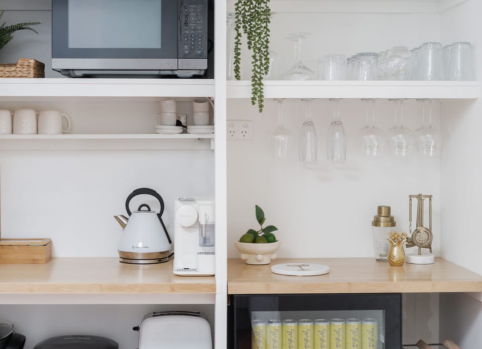 Appliances (indluding Nespresso coffee machine) are kept hidden.
