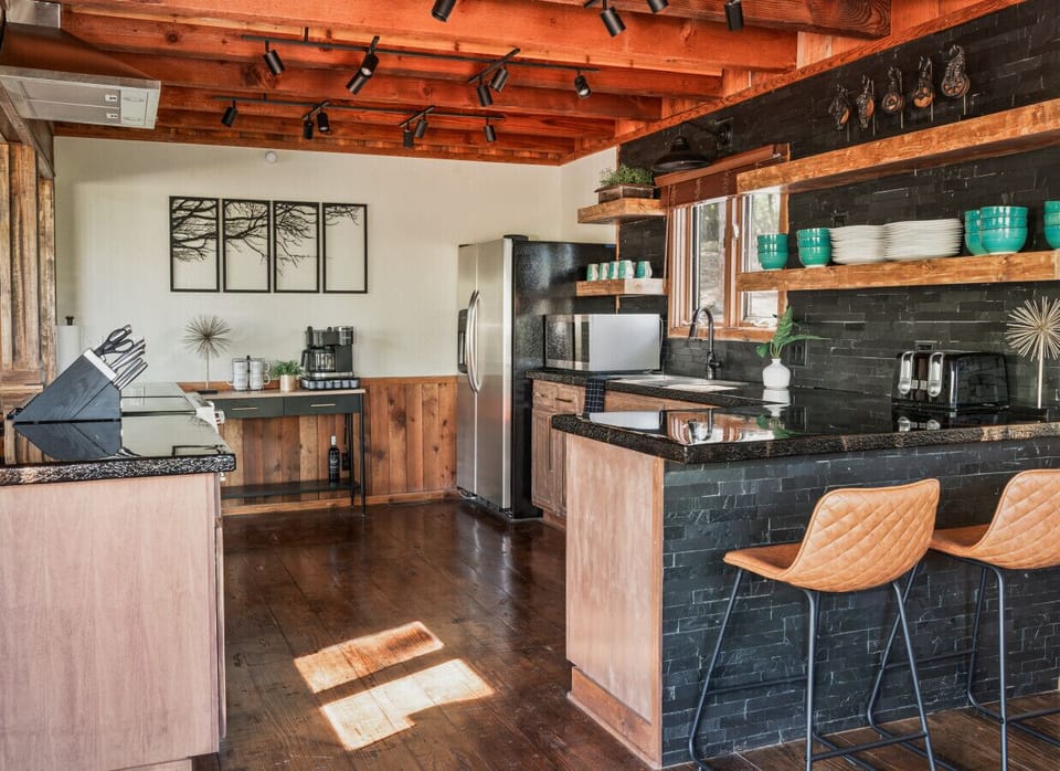 The modern, completely remodeled fully equipped, kitchen with all new appliances and coffee bar to make cooking meals easy