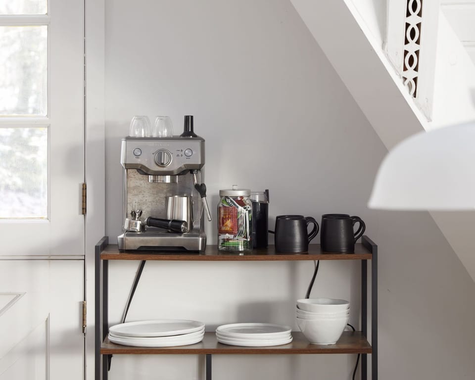 Coffee bar equipped with a Breville Espresso Machine.
