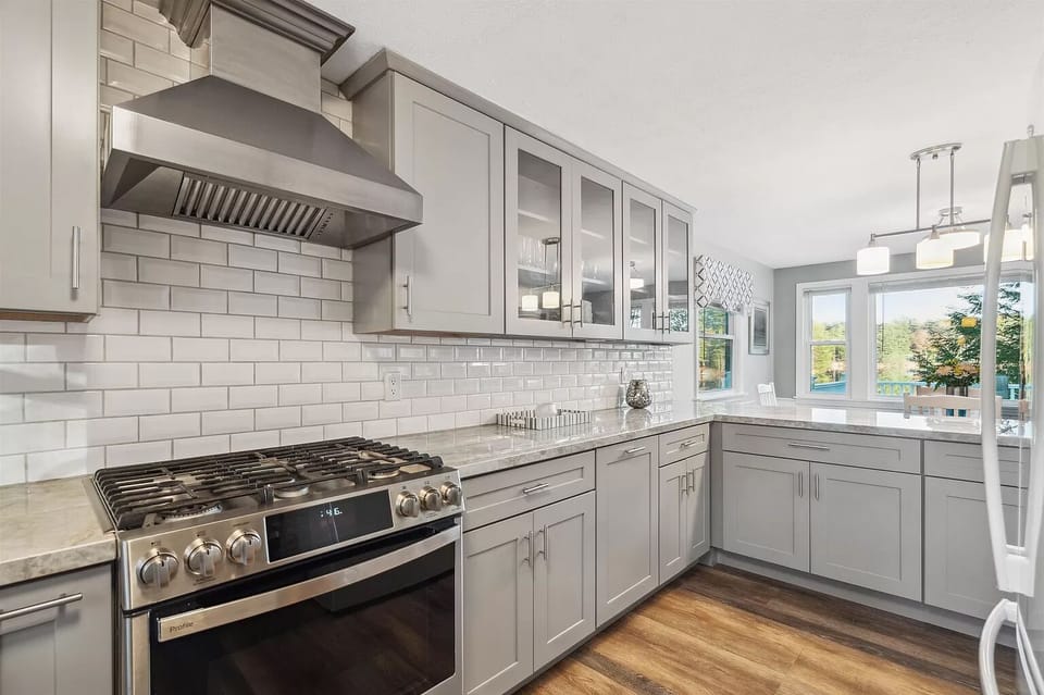 Fully equipped kitchen featuring a beautiful chef stove & granite countertops.