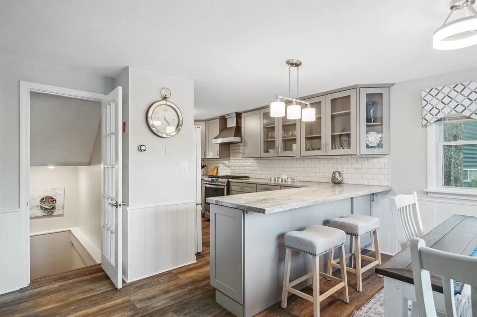 Kitchen view with a basement door leading to a 2nd family room 