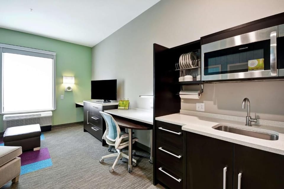 Settle in with a kitchenette and desk for easy routines.