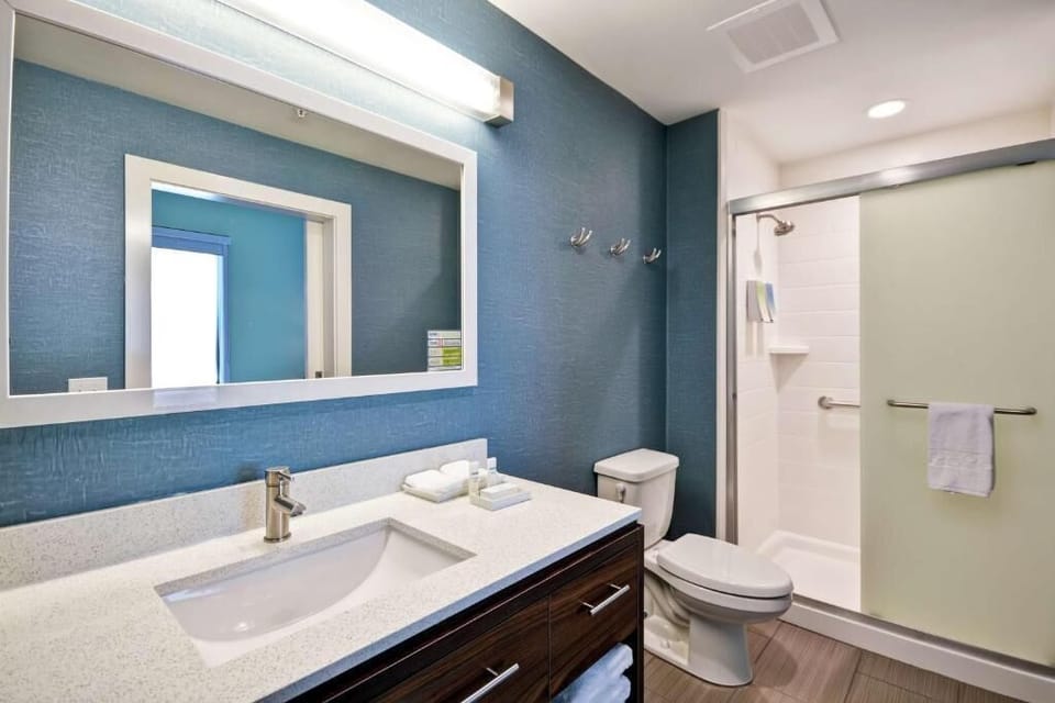 Refresh effortlessly in a spotless bath with spacious vanity.