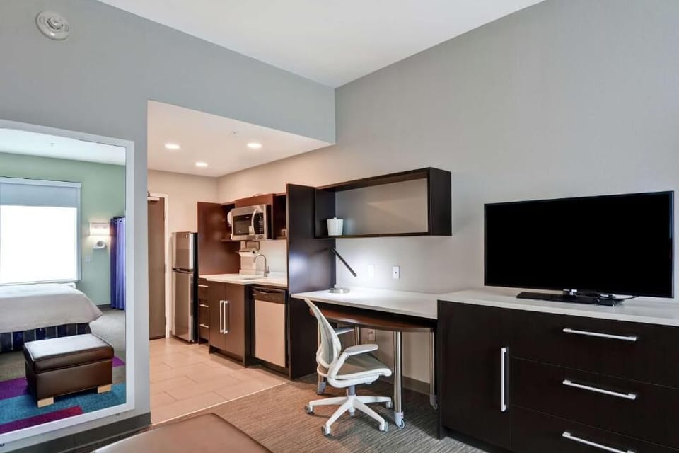 Catch up on emails at the roomy desk with streaming TV.