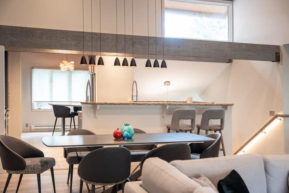 Living Room: Grab a seat at the table for a home-cooked meal or hang out at the breakfast bar with a coffee—this kitchen is ready for your stay.