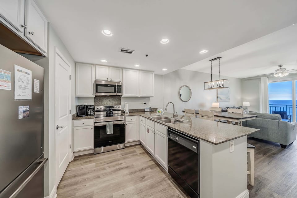 The fully equipped kitchen features granite countertops and stainless-steel appliances and has everything you need to cook meals for family and friends.