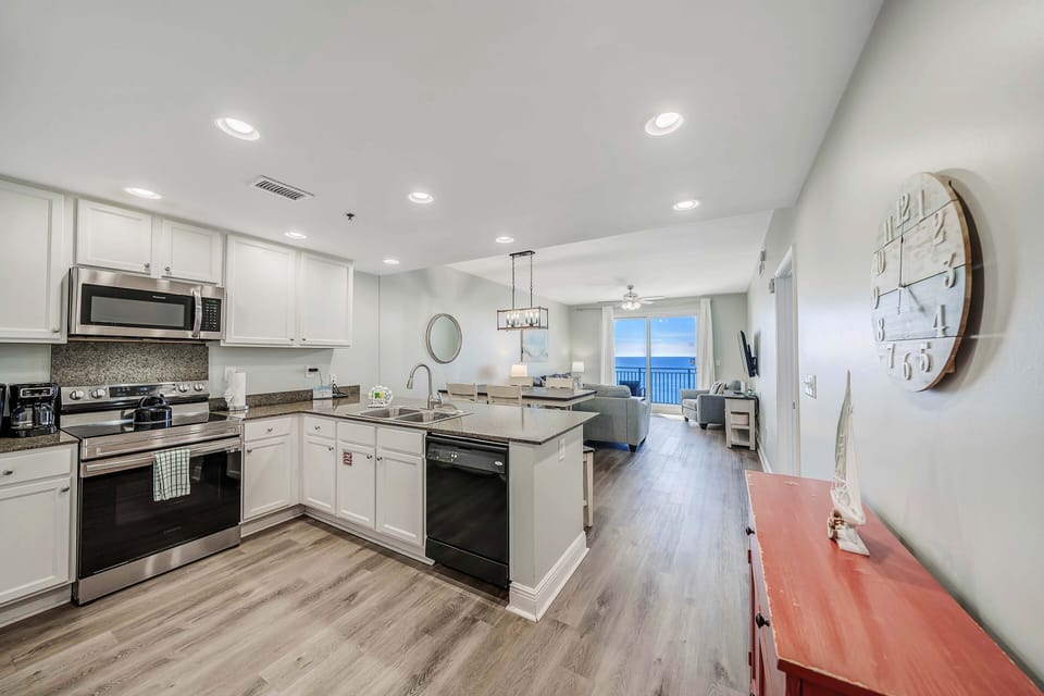 The fully equipped kitchen features granite countertops and stainless-steel appliances and has everything you need to cook meals for family and friends.
