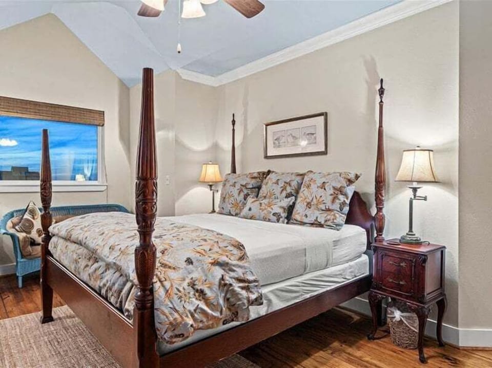 Bedroom with ocean views and large windows—wake up to the Gulf Coast sunrise.