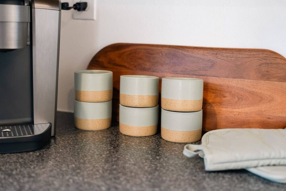 Enjoy your morning coffee with our stylish mugs and convenient coffee maker.