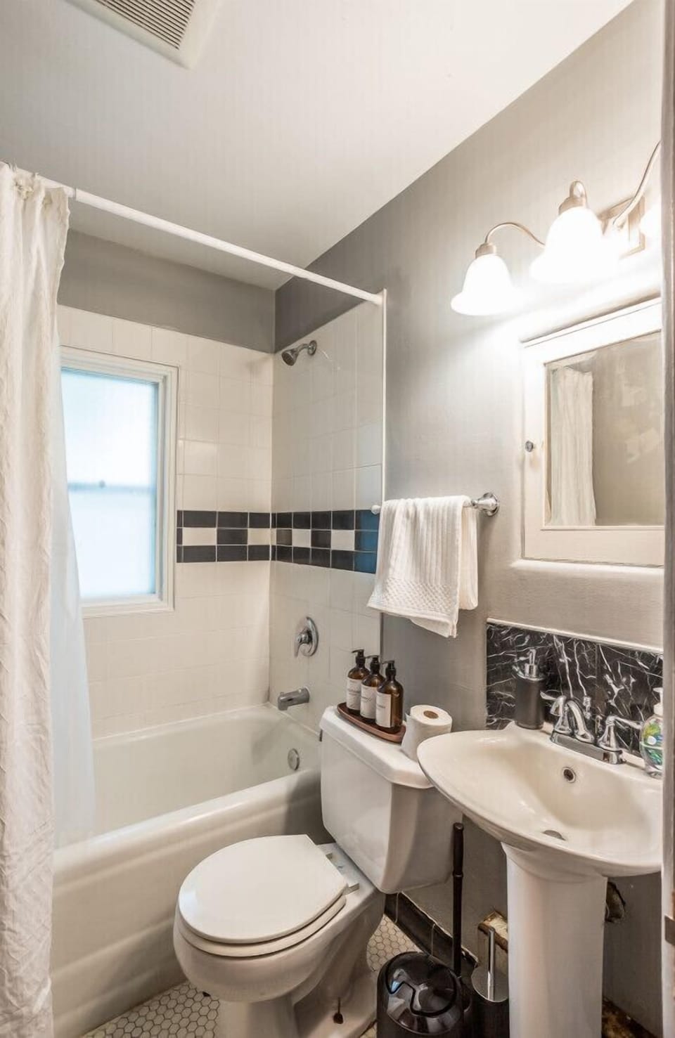 The bathroom in this lovely retreat is clean and well-appointed, providing all the necessary amenities for your comfort.