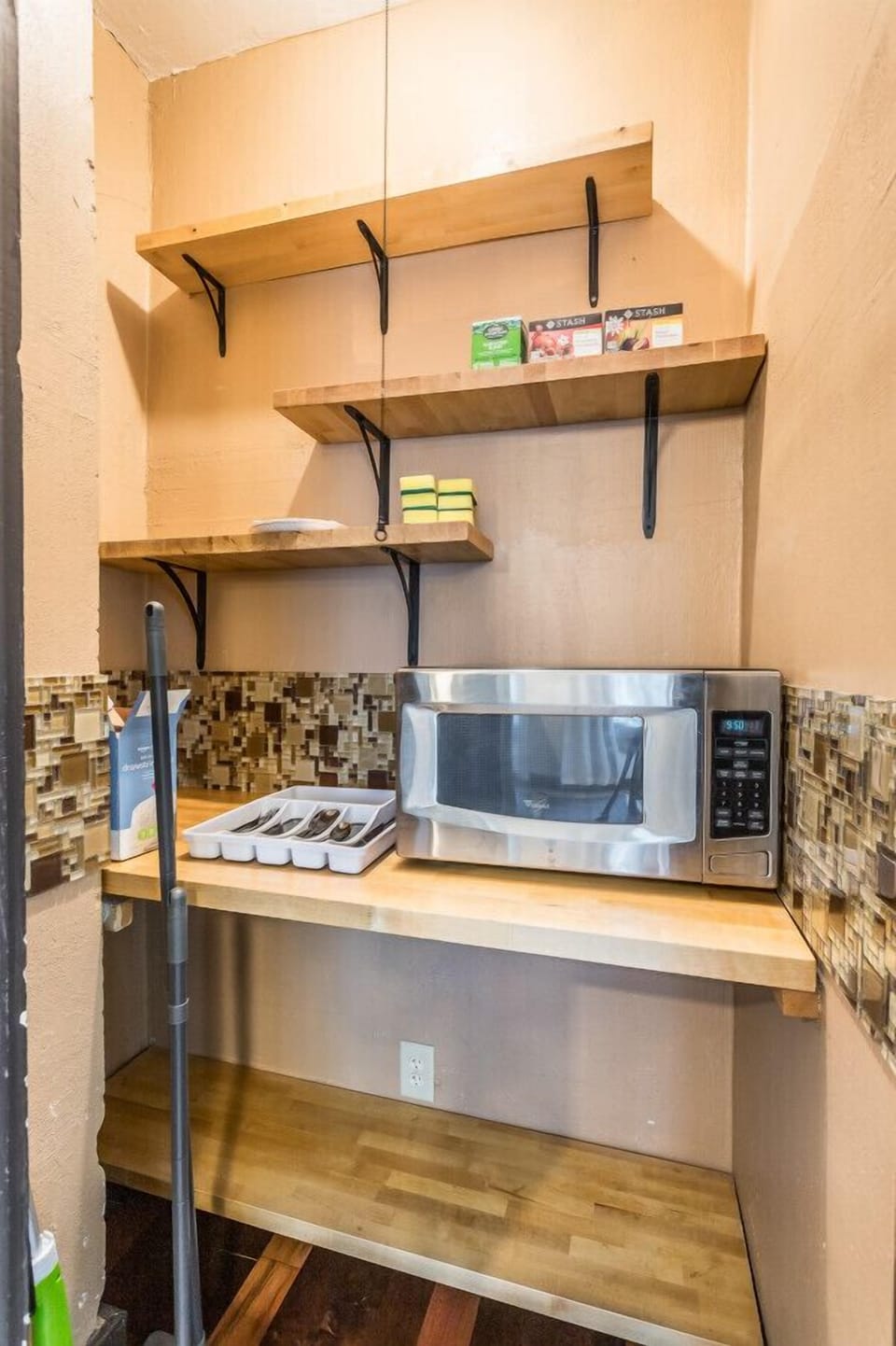 Conveniently tucked away, our pantry includes a microwave for quick and easy meal preparations. Enjoy the convenience and efficiency of our well-stocked pantry
