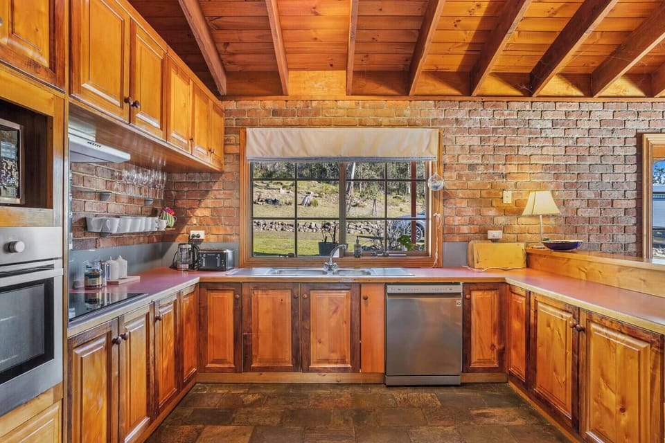 A full kitchen allows for easy at-home cooking, offering an oven and a dishwasher. 
