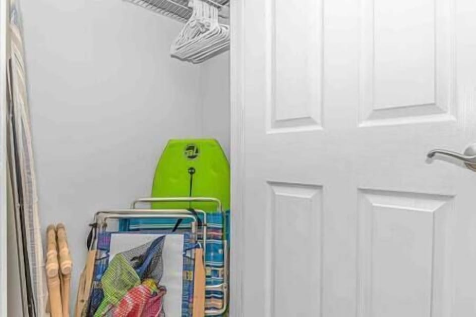 Bedroom closet showcasing beach supplies available to our guests!