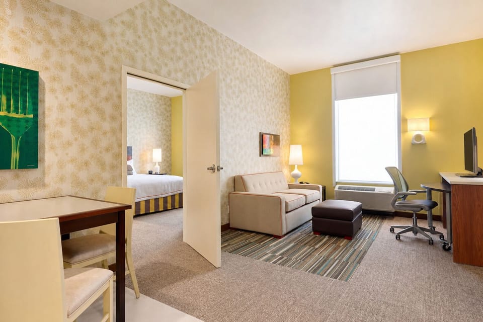 Settle into a cozy lounge area with work space nearby.