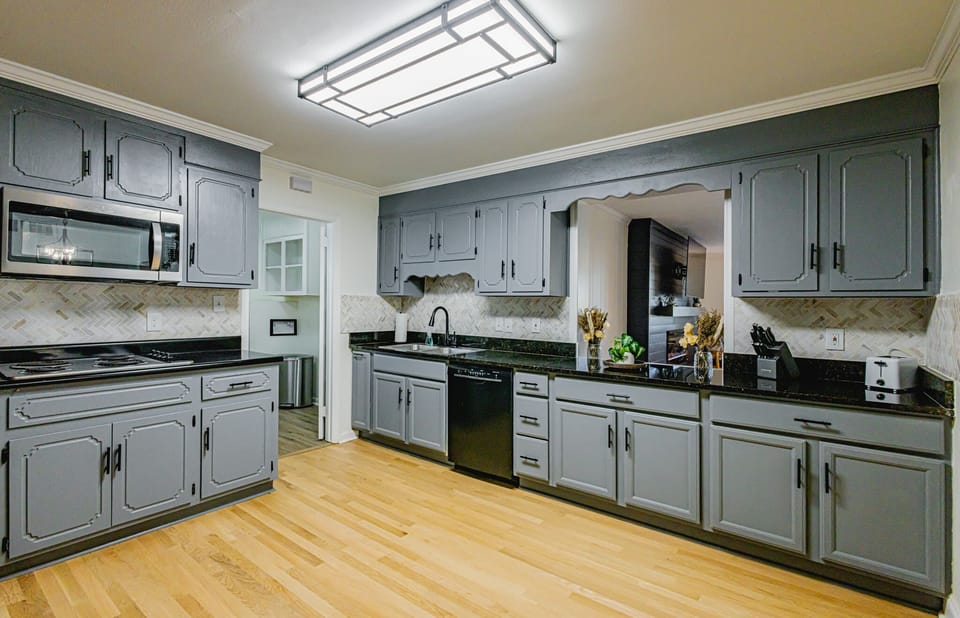 Organized kitchen with cooking basics and storage. Perfect for short or extended stays. 