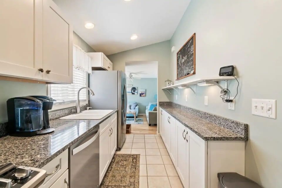 Kitchen in Unit B ( view from dinning room table towards the living room/ entry way)