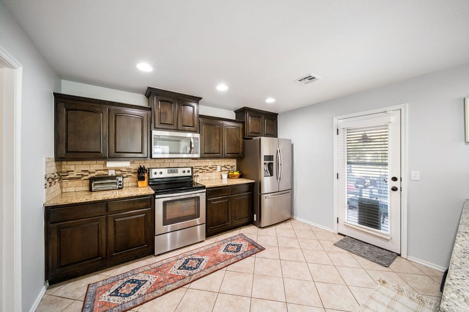 Spacious kitchen with plenty of cabinet storage.  Fully stocked with all the cooking essentials.