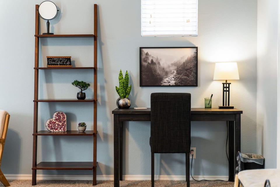 Work station in the master suite. Plenty of lighting, shelves and pens as well as a comfortable chair to sit in while you work.