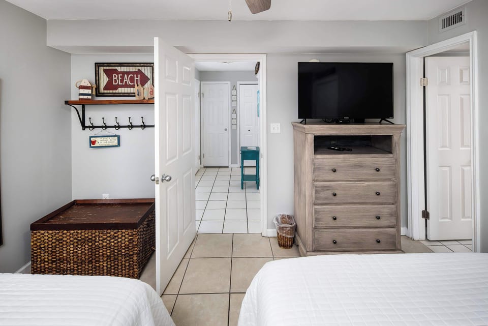 Second bedroom with two full size beds and TV