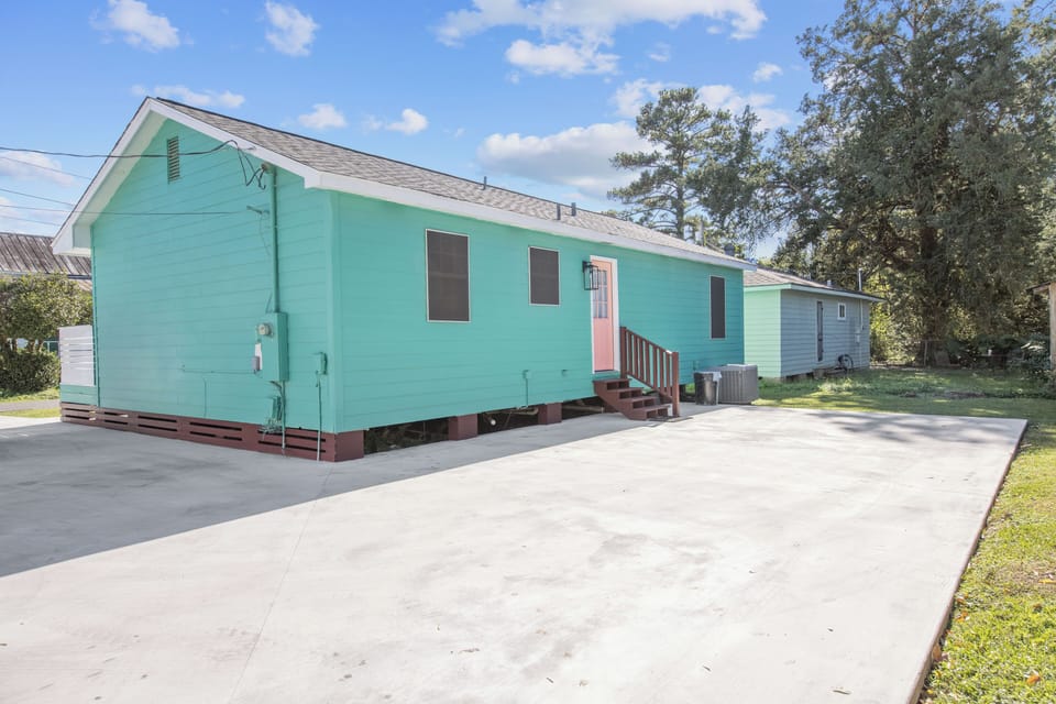 Back of the house has an entry as well as extra parking. 