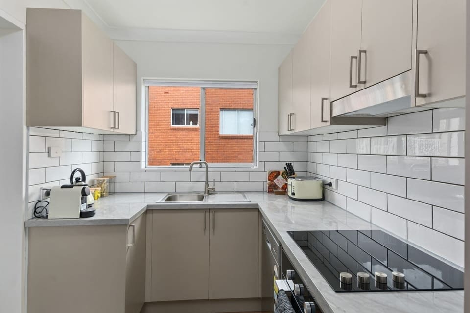 The contemporary kitchen comes with a coffee pod machine for slow mornings at home.
