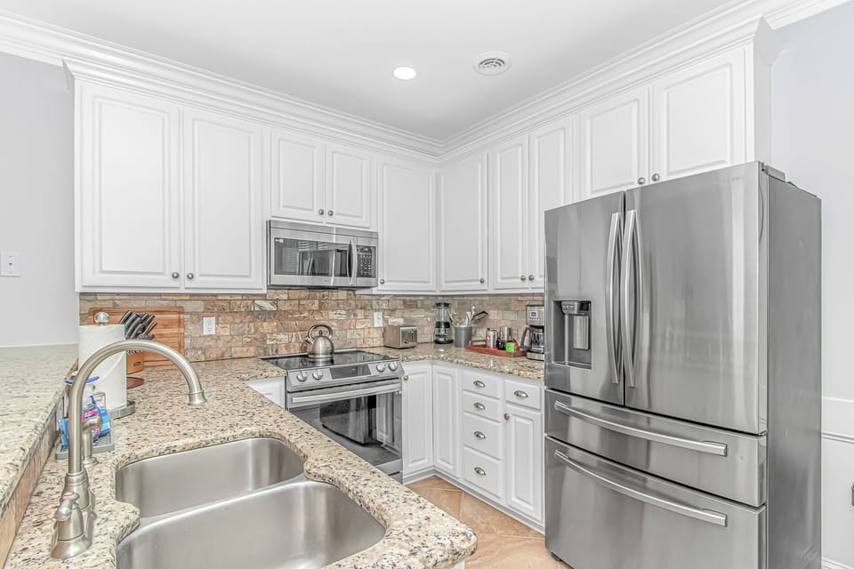 Kitchen with a full complement of stainless steel Samsung appliances
