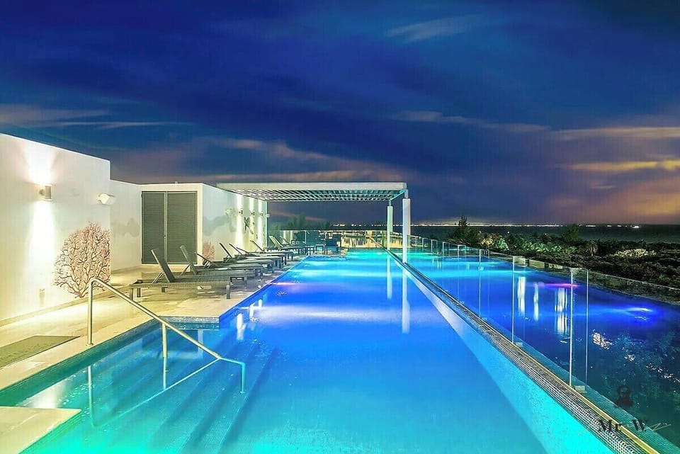 Enjoy a stunning sunset from the illuminated pool.