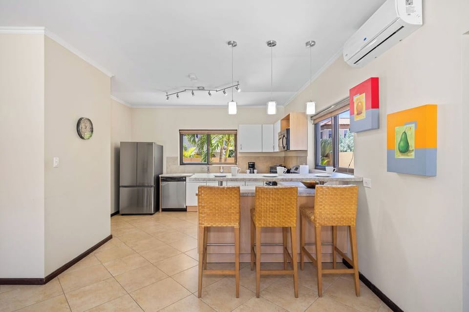 Pull up a seat and savor the moment – our kitchen bar with seating for three is the perfect spot for casual conversations and culinary delights.