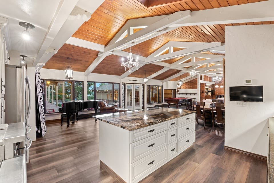First floor full kitchen looking out to courtyard and family room