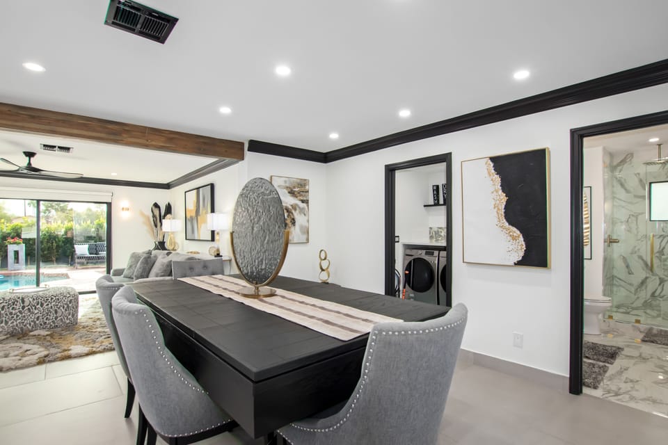 Dining area with seating for 6. Bonus: The dining table converts into a pool table.