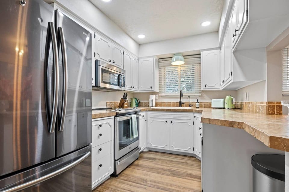 Fully-equipped kitchen with all necessary kitchen cooking utensils and dish-ware
