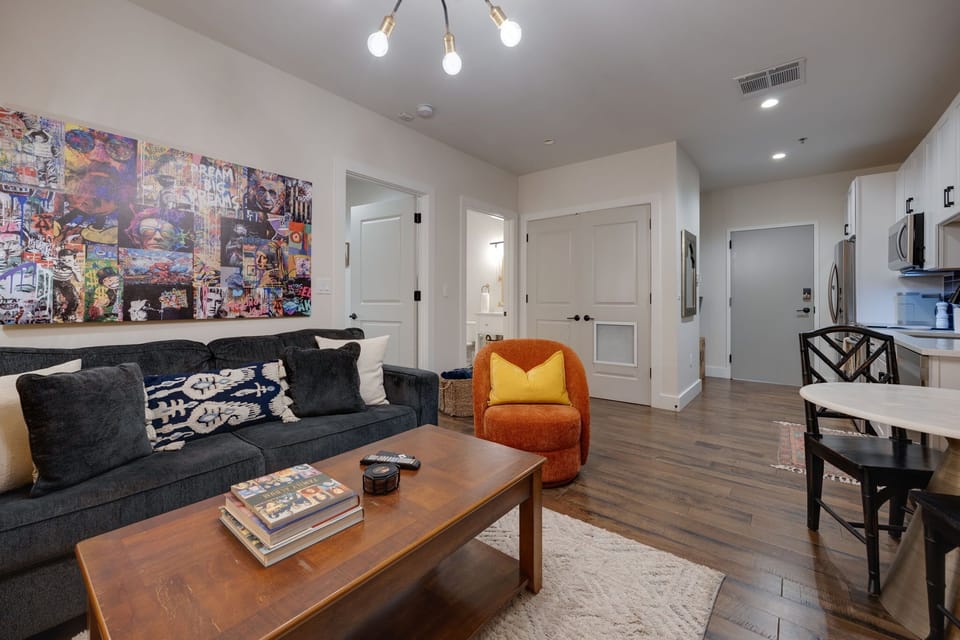 Living Room: Vibrant art and modern furnishings create the perfect backdrop for relaxation and fun!