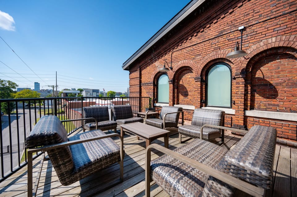 Unwind with city views in stylish seating under a sunny Nashville sky!