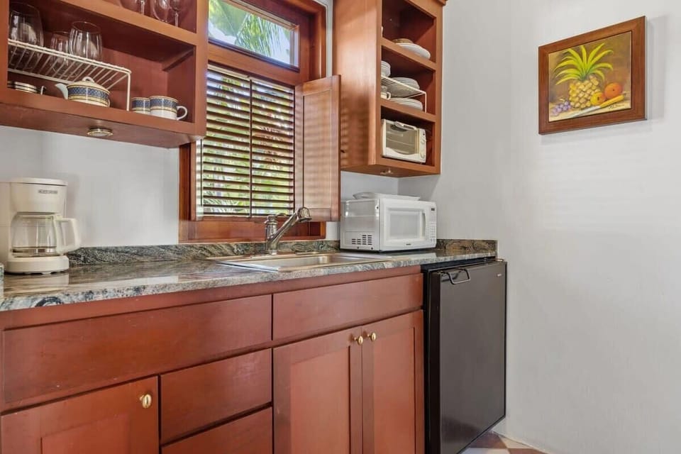 The kitchenette has a mini fridge, microwave, toaster, portable single burner, coffee maker and blender.