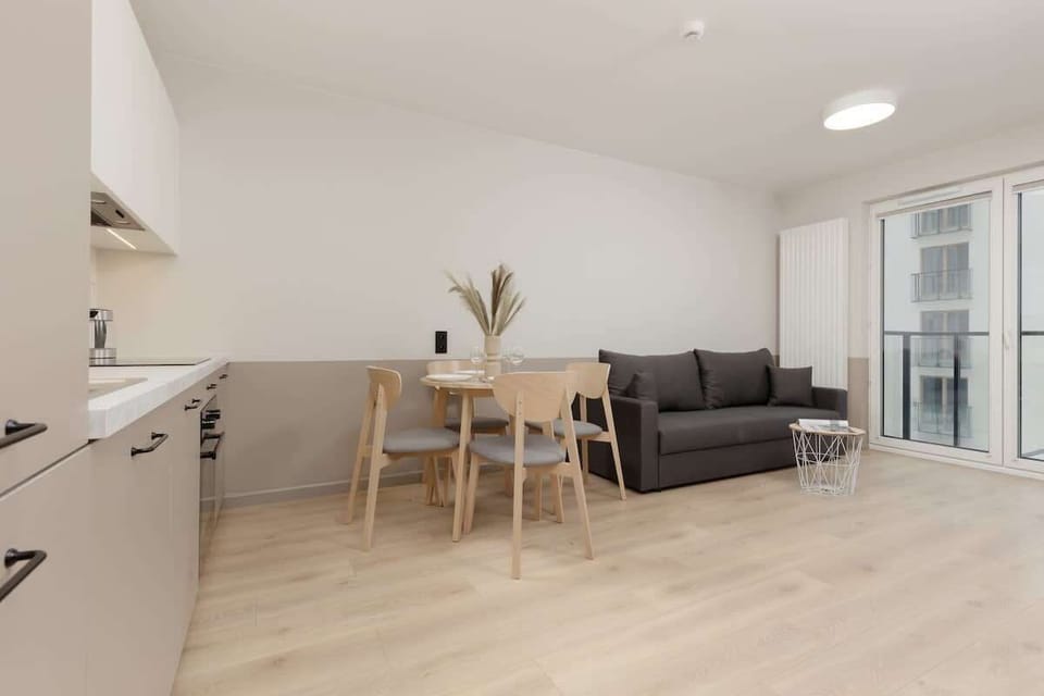Living room with a comfortable sofa, table and TV.