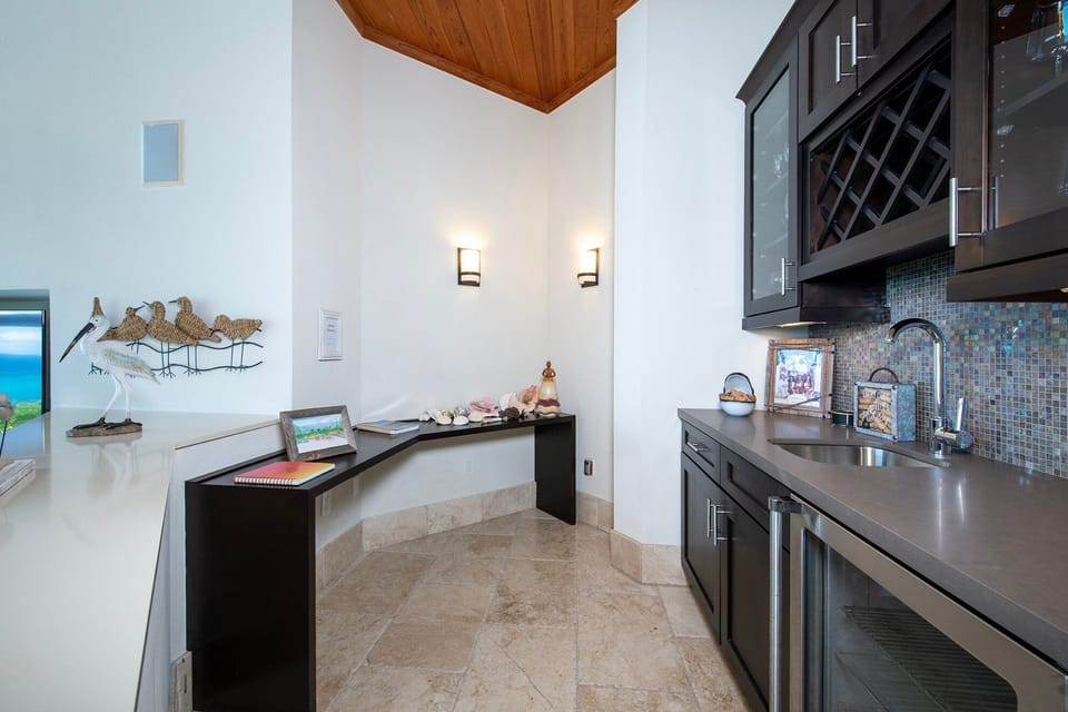 Complete wet bar overlooking the great room.