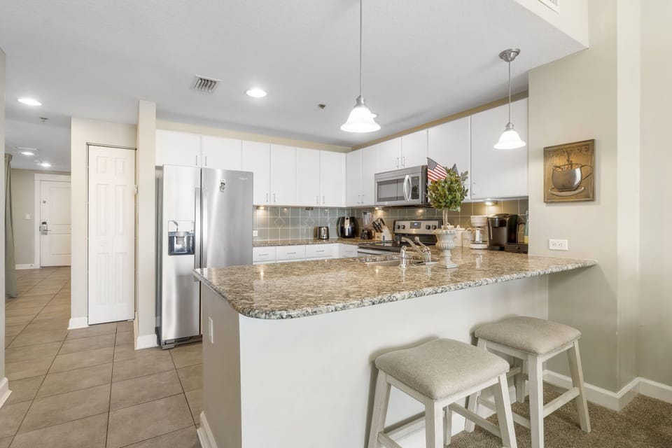 Modern kitchen with granite countertops and stainless steel appliances