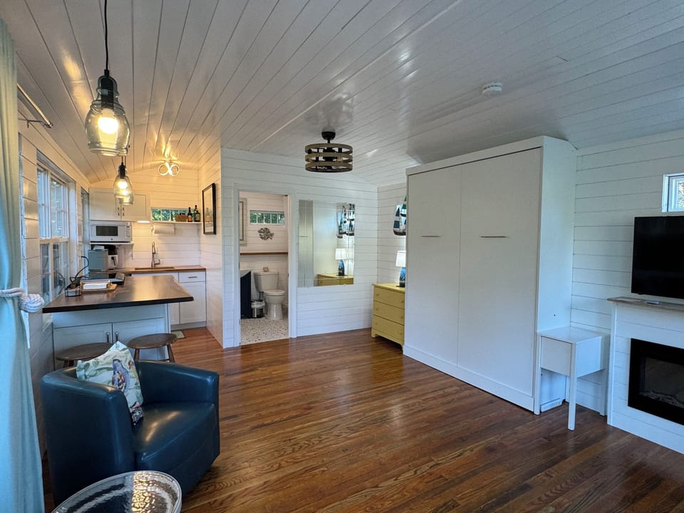 The queen bed tucks into the wall for even more open area if you'd like