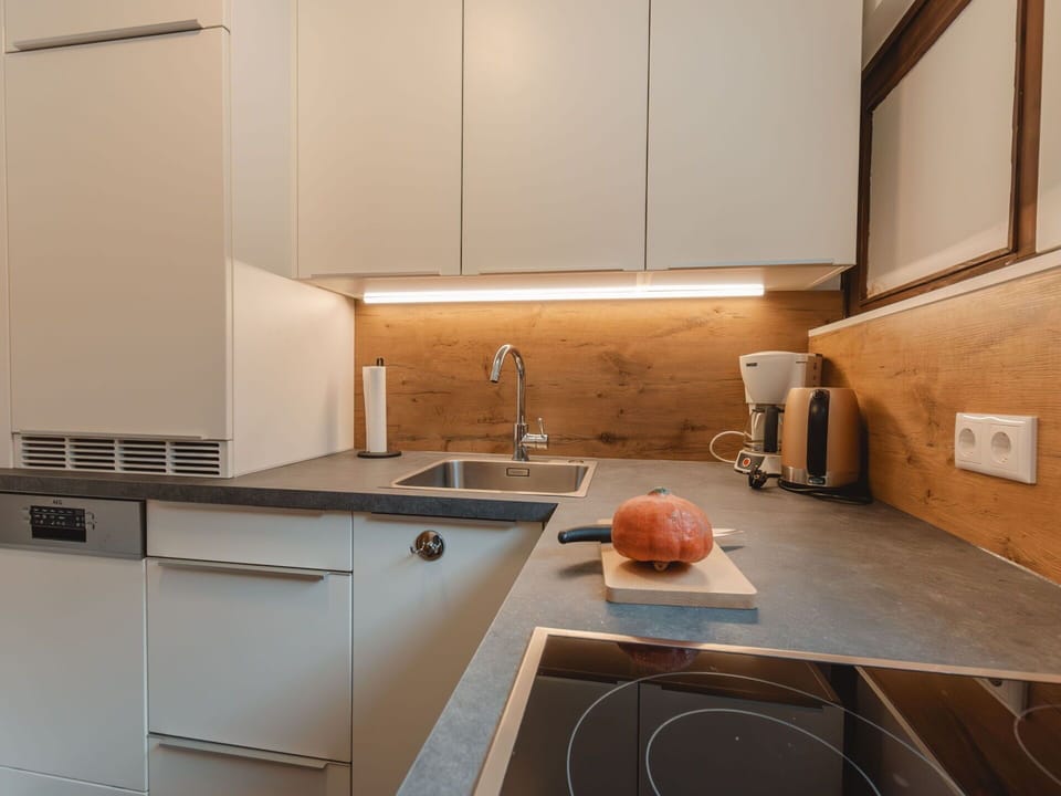 Cabinetry, Property, Countertop, Tap, Kitchen Sink, Kitchen Stove, Kitchen, Sink, Plumbing Fixture, Wood