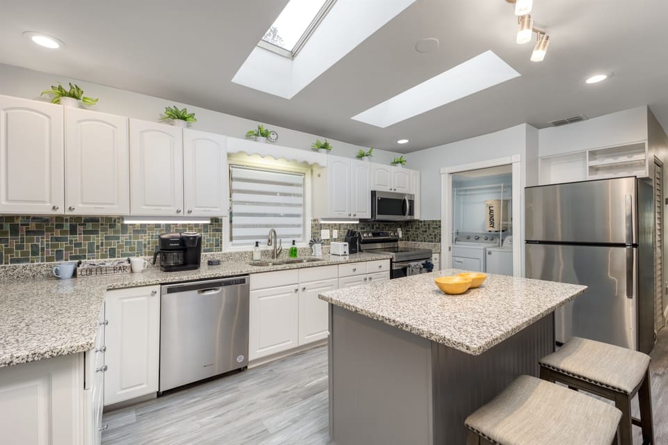 Whip up your favorite meals in our fully equipped kitchen! You'll find everything you need, from stainless steel appliances to a complete set of plates, cups, silverware, and small appliances.