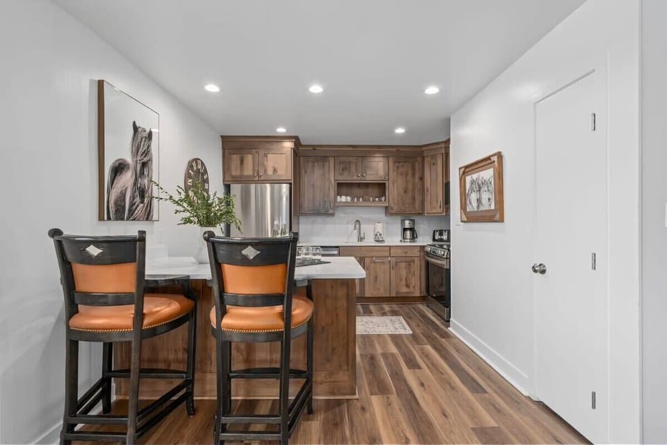 Kitchen: Renovated open kitchen with modern appliances and room to cook for the whole crew.