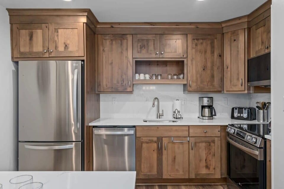 Kitchen: Renovated open kitchen with modern appliances and room to cook for the whole crew.