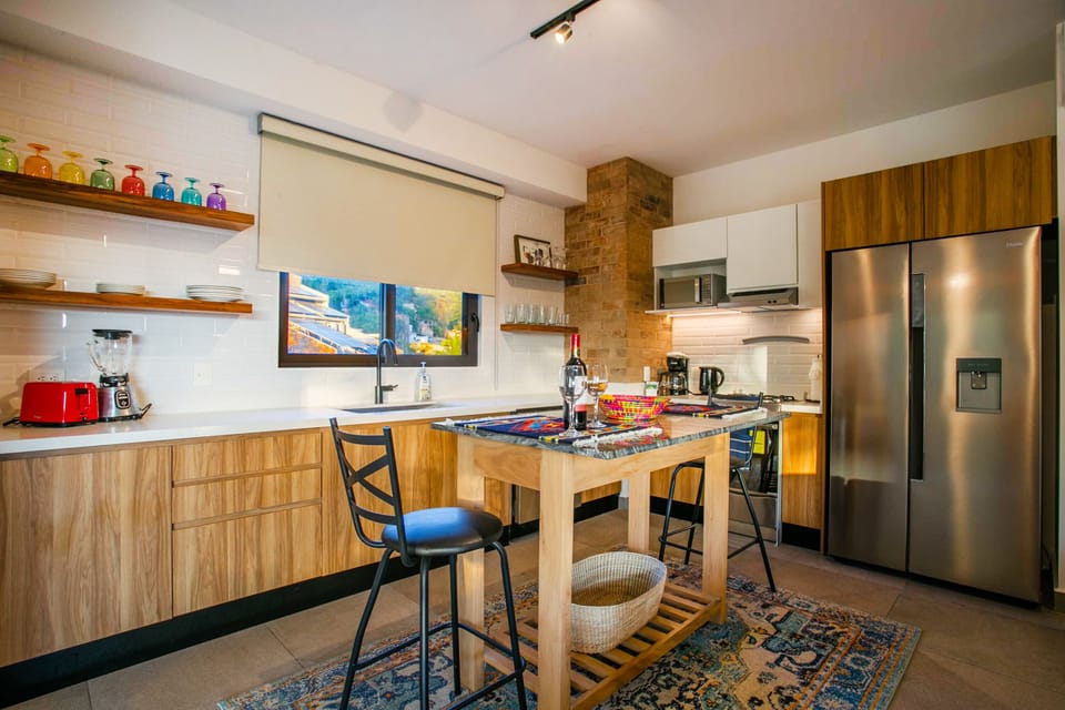 Kitchen amenities include a full-size fridge, stove, oven and microwave