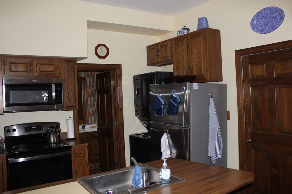 Kitchen and Entry to First Floor Bathroom with shower.