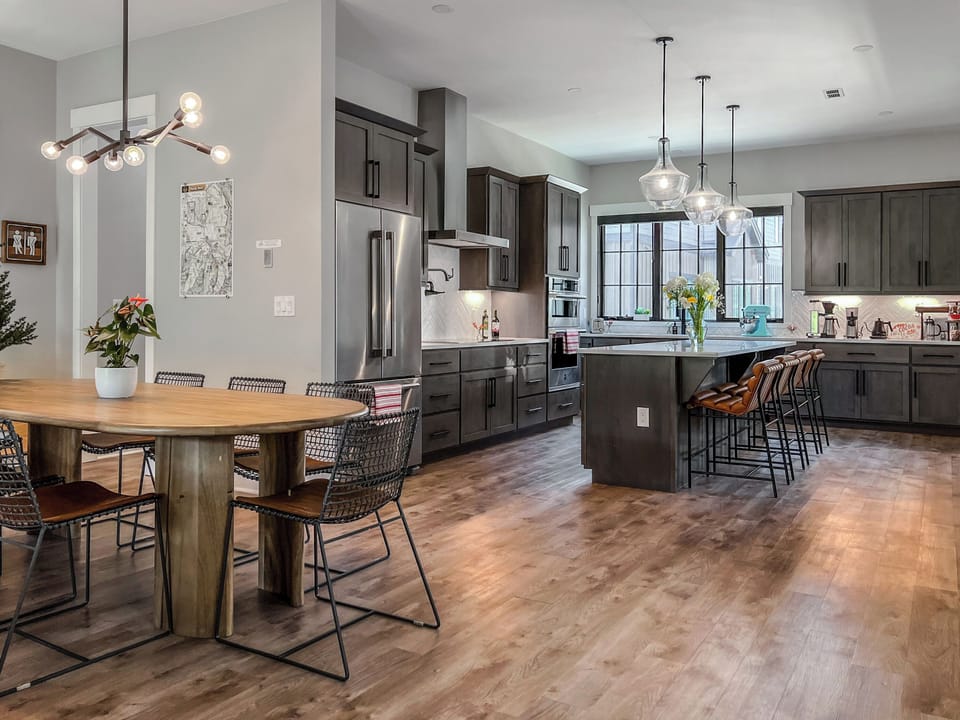 - Open kitchen and dining layout offers space to gather and connect easily - Warm hardwood floors and pendant lights create a welcoming modern vibe - Cook, dine, and unwind all in one bright and stylish central setting