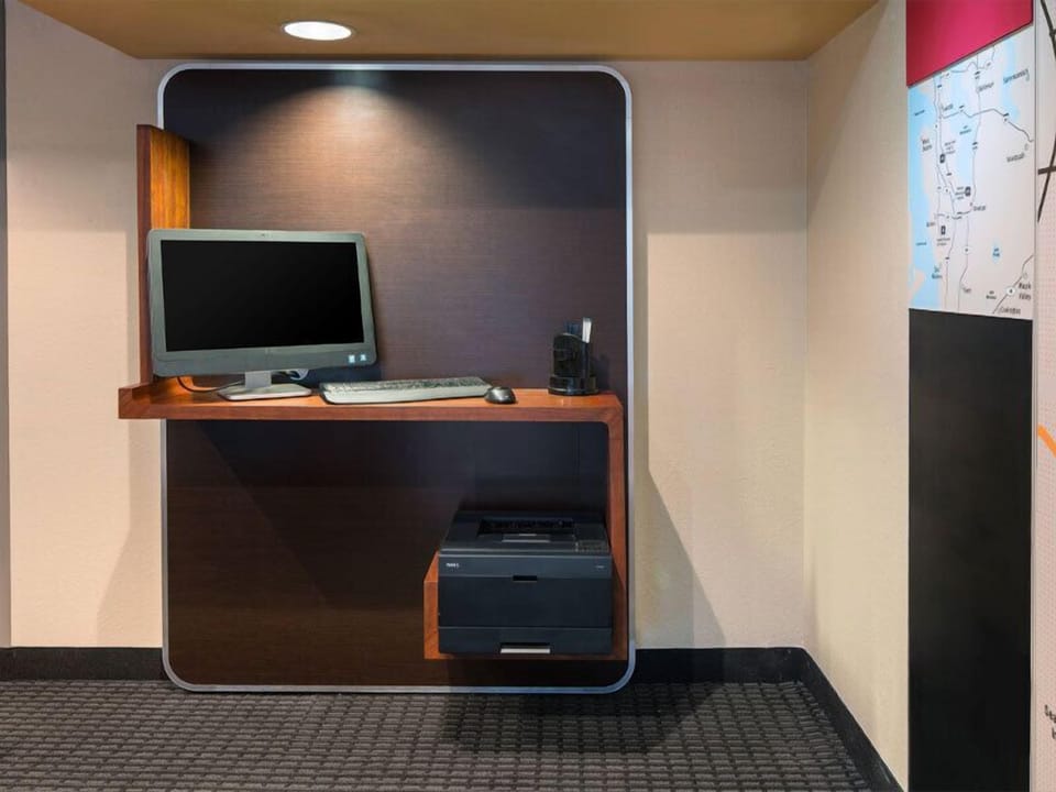 Catch up on emails in a quiet workspace with printing.