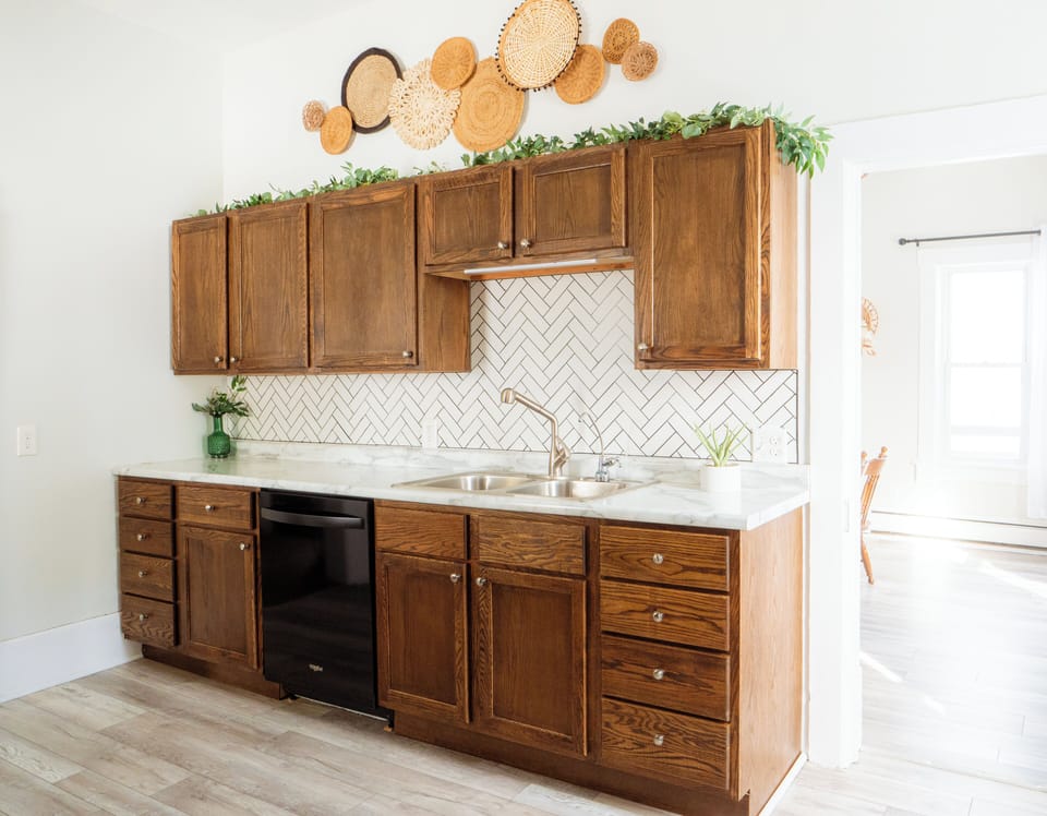 Fully stocked kitchen with a dishwasher.