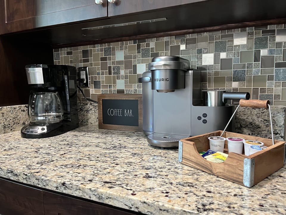 Coffee bar in kitchen - drip coffee machine and Keurig machine
